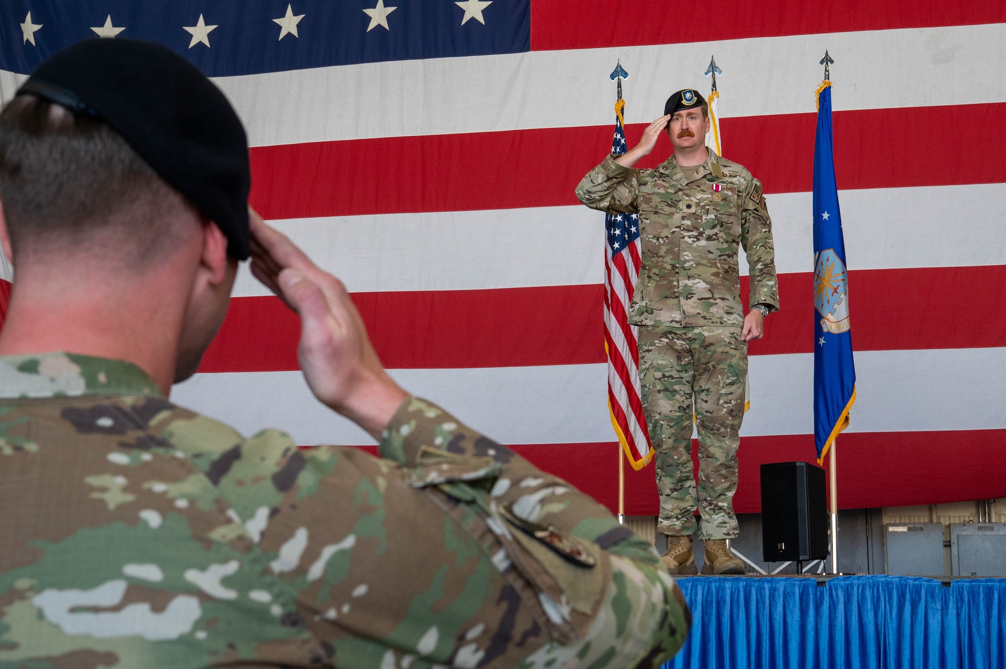 U.S. Air Force Lt. Col. Ryan Kiggings, 8th Security Forces Squadron outgoing commander, gives his final salute to the squadron during the 8th SFS change of command ceremony at Kunsan Air Base, Republic of Korea, June 12, 2026. Change of command ceremonies represent the formal transfer of authority and responsibility for a squadron, group or wing from one commanding officer to another. (U.S. Air Force photo by Staff Sgt. Cedrique Oldaker)