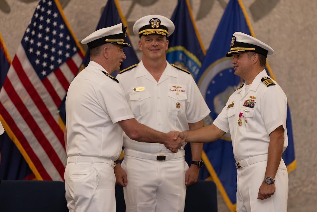 NAVAL BASE GUAM (June 15, 2026) – From left, Capt. Shawn William; Commander, Joint Region Marianas Rear Adm. Brett Mietus; and Capt. John T. Frye during the U.S. Naval Base Guam Change of Command at NBG Chapel, June 12. Frye served as NBG commanding officer from January 2024 to June 2026. NBG provides installation support to homeported commands, tenant activities, deployed forces, and visiting units while sustaining readiness and quality of life in support of U.S. Indo-Pacific operations.