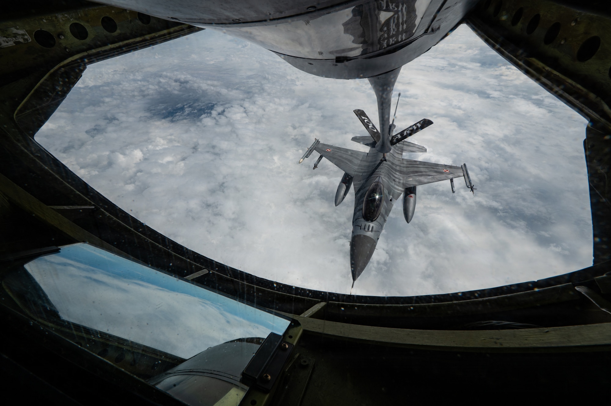 A U.S. Air Force KC-135 Stratotanker assigned to the 100th Air Refueling Wing, provides fuel to a Polish Air Force F-16C during a refueling mission as part of Ramstein Flag 26 over Finland, June 12, 2026.