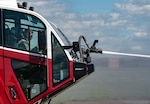 Capt. Timothy Lenihan, commander of Montana Army National Guard firefighting detachments, operates the mounted turret of an aircraft rescue firefighting vehicle during a joint training exercise at the 120th Airlift Wing in Great Falls, Montana, June 11, 2026. The exercise provided Soldiers hands-on experience operating specialized firefighting equipment and responding to simulated aircraft emergencies. Photo by Senior Master Sgt. Devin Doskey.