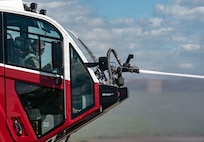 Capt. Timothy Lenihan, commander of Montana Army National Guard firefighting detachments, operates the mounted turret of an aircraft rescue firefighting vehicle during a joint training exercise at the 120th Airlift Wing in Great Falls, Montana, June 11, 2026.