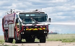 Soldiers assigned to Montana Army National Guard firefighting detachments operate an aircraft rescue firefighting vehicle during a joint live-fire training exercise at the 120th Airlift Wing in Great Falls, Montana, June 11, 2026. Participants trained on vehicle operations, fire suppression techniques and airfield emergency response procedures. Photo by Senior Master Sgt. Devin Doskey.