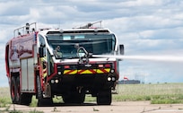 Soldiers assigned to Montana Army National Guard firefighting detachments operate an aircraft rescue firefighting vehicle during a joint live-fire training exercise at the 120th Airlift Wing in Great Falls, Montana, June 11, 2026.