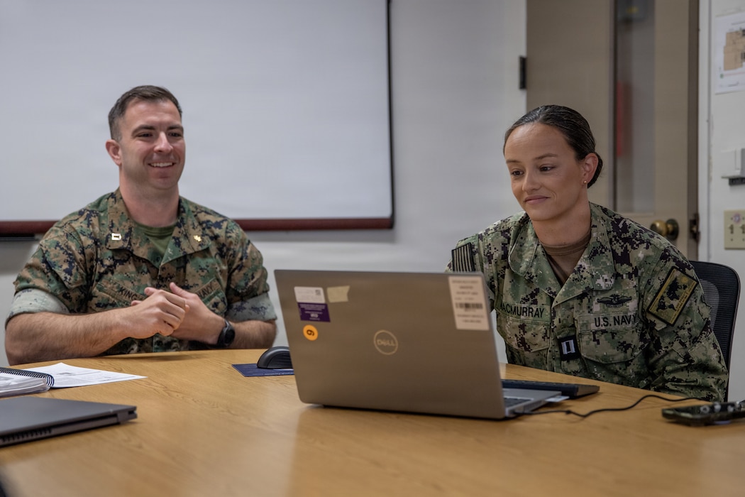 Trauma Nursing Core Course program directors U.S. Navy Lt. Justin King, assigned to 1st Medical Battalion, and Lt. Krista MacMurray, assigned to Navy Medicine Readiness and Training Command San Diego, conduct an online class during the launch of the pilot virtual TNCC program at Naval Medical Center San Diego, June 10. TNCC provides nurses with the critical thinking skills and hands-on training necessary to deliver high-quality trauma care. NMRTC San Diego supports Navy and Marine Corps readiness by ensuring its medical forces are ready to deploy and provide medical support, ashore or at sea. (U.S. Navy photo by Mass Communication Specialist 3rd Class Jason Afable)