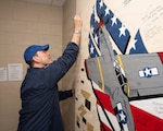 Honorable Michael Borders, Assistant Secretary of the Air Force for Energy, Installations and Environment, signs a heritage wall at the 323rd Training Squadron headquarters at Joint Base San Antonio-Lackland, Texas, June 5, 2026. The wall features signatures from distinguished visitors and leaders who have supported the Basic Military Training mission. (U.S. Air Force photo by Jonathan R. Mallard)