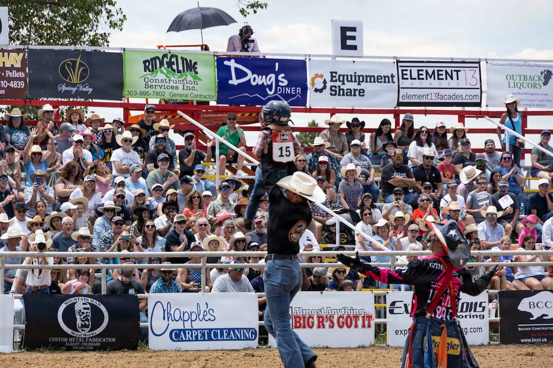 The U.S. Marine Corps Mounted Color Guard helps with the mutton busting event during the Elizabeth Stampede rodeo, June 6, 2026. As the last remaining mounted color guard in the Marine Corps, the unit’s participation in the Elizabeth Stampede showcased Marine Corps tradition, professionalism and horsemanship. (U.S. Marine Corps photo by Sgt. Davin Tenbusch)