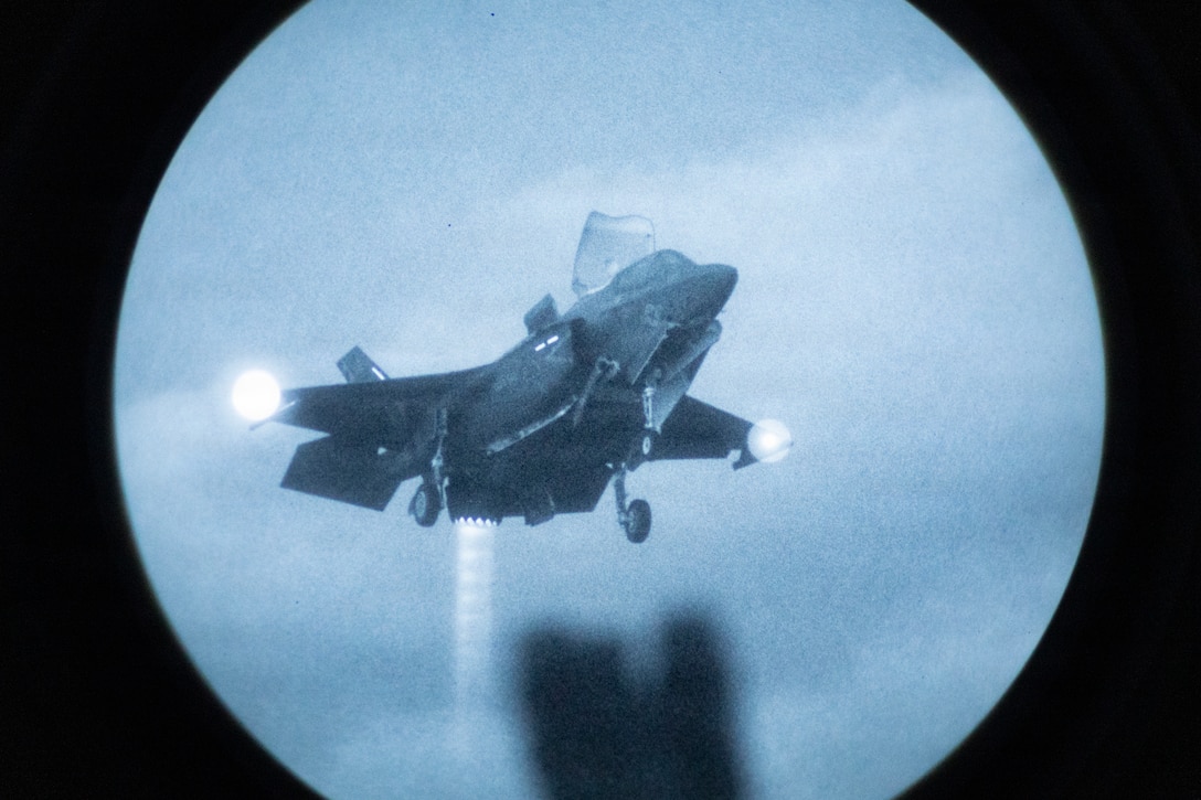 A U.S. Marine Corps F-35B Lightning II assigned to Marine Fighter Attack Squadron (VMFA) 542, 2nd Marine Aircraft Wing hovers above Wasp-class amphibious assault ship USS Kearsarge (LHD 3) while conducting low-light carrier qualifications during 26th Marine Expeditionary Unit’s Type Commander's Amphibious Training (TCAT), off the coast of North Carolina, June 11, 2026. TCAT is a military exercise designed to enhance mobility and integration between the U.S. Marine Corps and the U.S. Navy. The amphibious force is an integrated powerhouse providing sea, land, and air operations, giving geographic combatant commanders a more flexible, agile force for aggregated or dis-aggregated operations across the globe. (U.S. Marine Corps photo by Cpl. Matthew Williams)
