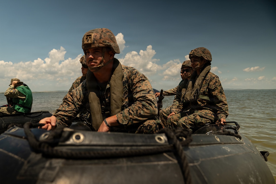 U.S. Marines with 4th Assault Amphibian Battalion, 4th Marine Division, receive instruction on combat rubber raiding craft operations from Romanian Marines of 307th Naval Infantry Regiment (NIR) during exercise Sea Breeze 26 at Babadag Training Area, Romania, June 10, 2026. Sea Breeze 26 is an annual exercise co-sponsored by U.S. Naval Forces Europe-Africa and Marine Corps Forces Europe-Africa, designed to develop interoperability of maritime and ground forces in the Black Sea Region through combined NATO deliberate planning, integration, and command and control of Marine Amphibious Forces. (U.S. Marine Corps photo by Sgt. Noah Masog)