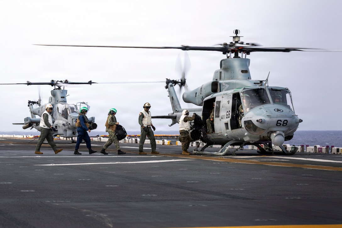 U.S. Marines and Sailors assigned to Wasp-class amphibious assault ship USS Kearsarge (LHD 3) embark a U.S. Marine Corps UH-1Y Venom assigned to Marine Light Attack Helicopter Squadron (HMLA) 167, 2nd Marine Aircraft Wing, during a routine medical evacuation while conducting 26th Marine Expeditionary Unit’s Type Commanders Amphibious Training (TCAT), off the coast of North Carolina, June 13, 2026. TCAT is a military exercise designed to enhance mobility and integration between the U.S. Marine Corps and the U.S. Navy. The amphibious force is an integrated powerhouse providing sea, land, and air operations, giving geographic combatant commanders a more flexible, agile force for aggregated or dis-aggregated operations across the globe. (U.S. Marine Corps photo by Cpl. Matthew Williams)