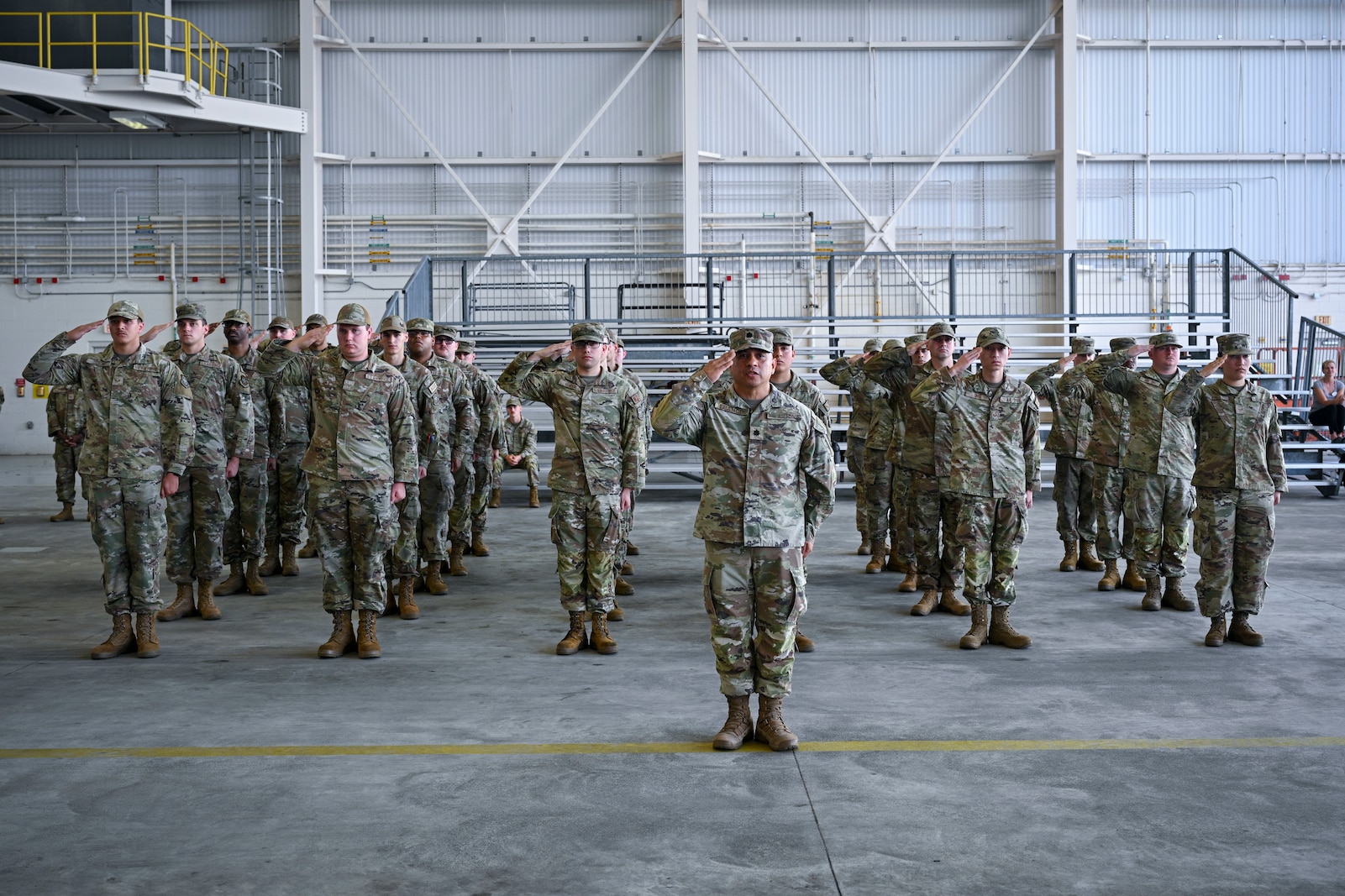 U.S. Air Force Airmen render honors during the final salute at a change of command ceremony.