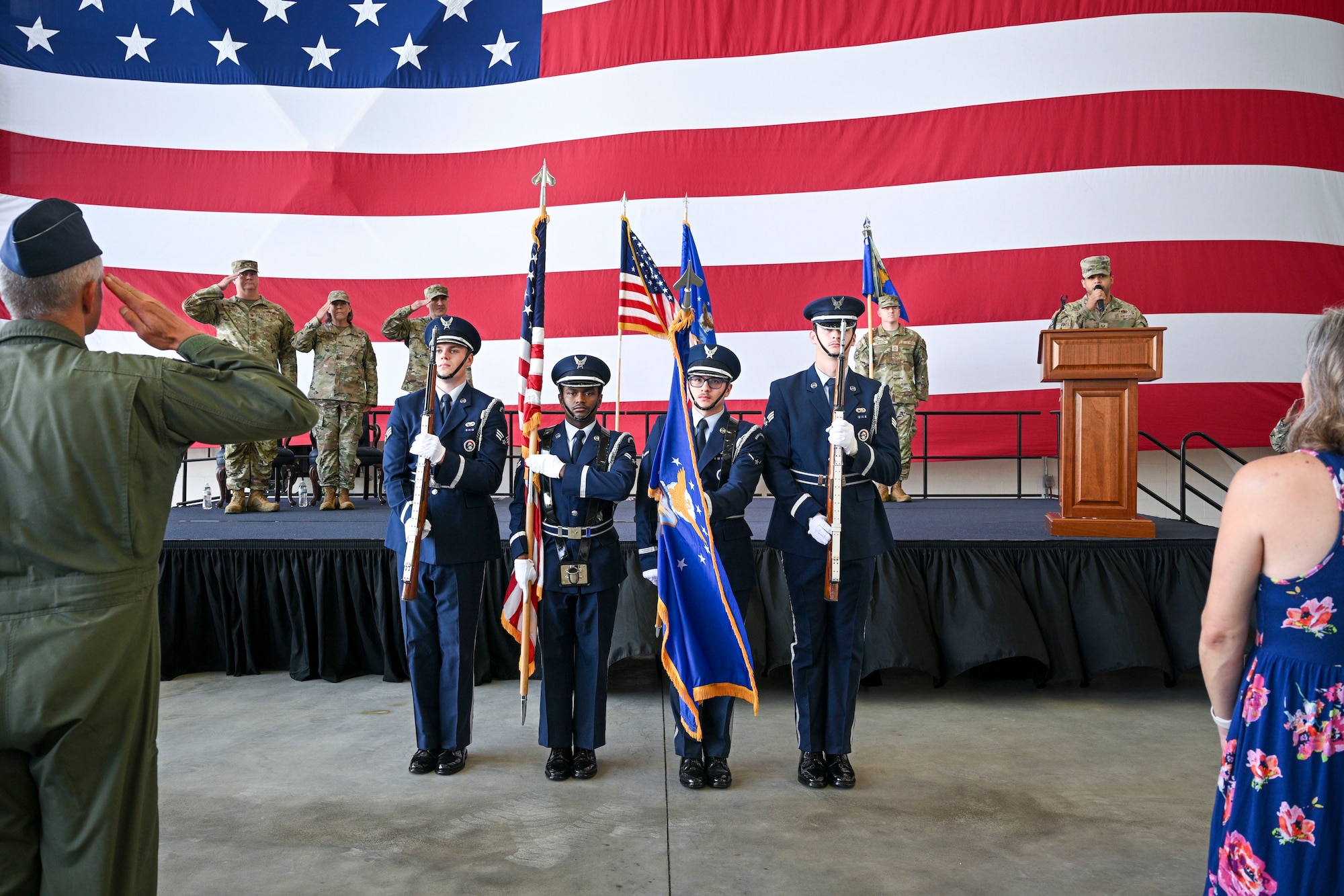Four U.S. Air Force Honor Guard members present the colors during a ceremony.