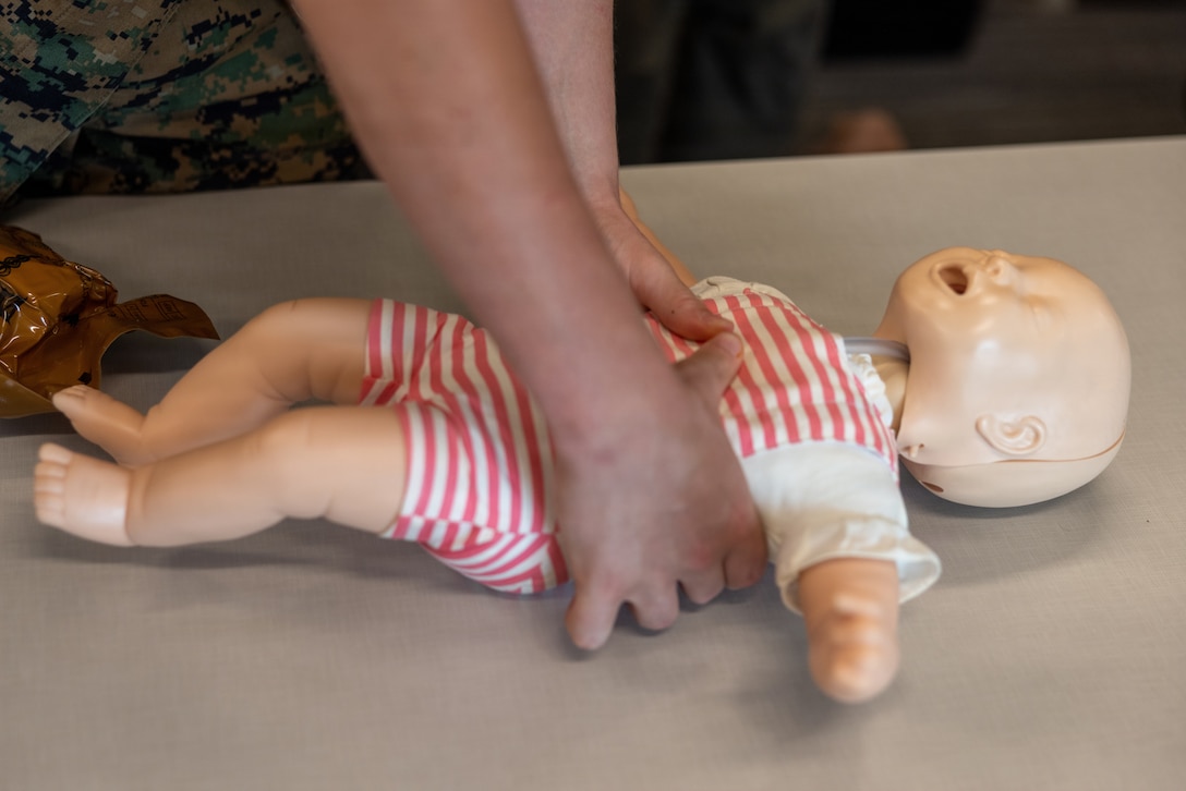 U.S. Marine Corps Pfc. Christian Reinhardt, admin clerk with Headquarters and Headquarters Squadron, Marine Corps Air Station New River and the MCAS New River Shelter Team, performs infant chest compressions during a cardiopulmonary resuscitation class at the Marine Corps Medical Home New River at MCAS New River, North Carolina, June 8, 2026. The MCAS New River Medical Team provided CPR training to the MCAS New River Shelter Team to enhance the base’s emergency response capabilities in order to promote flexibility and readiness during the Atlantic hurricane season, which runs from June 1 to November 30. (U.S. Marine Corps photo by Lance Cpl. Alyssa J. DeCrane)