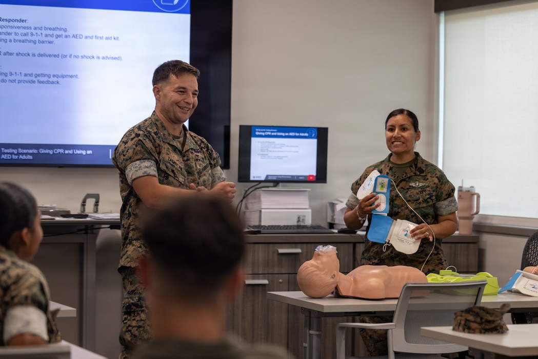 U.S. Marine Corps Capt. Sebastian Tamblyn, left, shelter officer in charge, Marine Corps Air Station New River, and U.S. Navy Petty Officer 1st Class Roxana Q. Lacey, field medical technician, Marine Medium Tiltrotor Squadron 264, Marine Aircraft Group 26, 2nd Marine Aircraft Wing, give a demonstration during a cardiopulmonary resuscitation class at the Marine Corps Medical Home New River at MCAS New River, North Carolina, June 8, 2026. The MCAS New River Medical Team provided CPR training to the MCAS New River Shelter Team to enhance the base’s emergency response capabilities in order to promote flexibility and readiness during the Atlantic hurricane season, which runs from June 1 to November 30. (U.S. Marine Corps photo by Lance Cpl. Alyssa J. DeCrane)