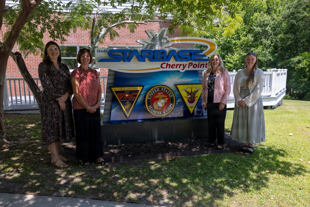 Christy Hazlett, STARBASE program director, Jackie Rideout, Trish Smith, wife of the 39th Commandant of the Marine Corps, and Hadley Smith pose for a photograph at Marine Corps Air Station Cherry Point, June 11, 2026. Smith toured facilities on base to gain insight into the quality of life programs and opportunities available to military members and their families, including education, employment and community support services. (U.S. Marine Corps photo by Lance Cpl. Emma Powell)