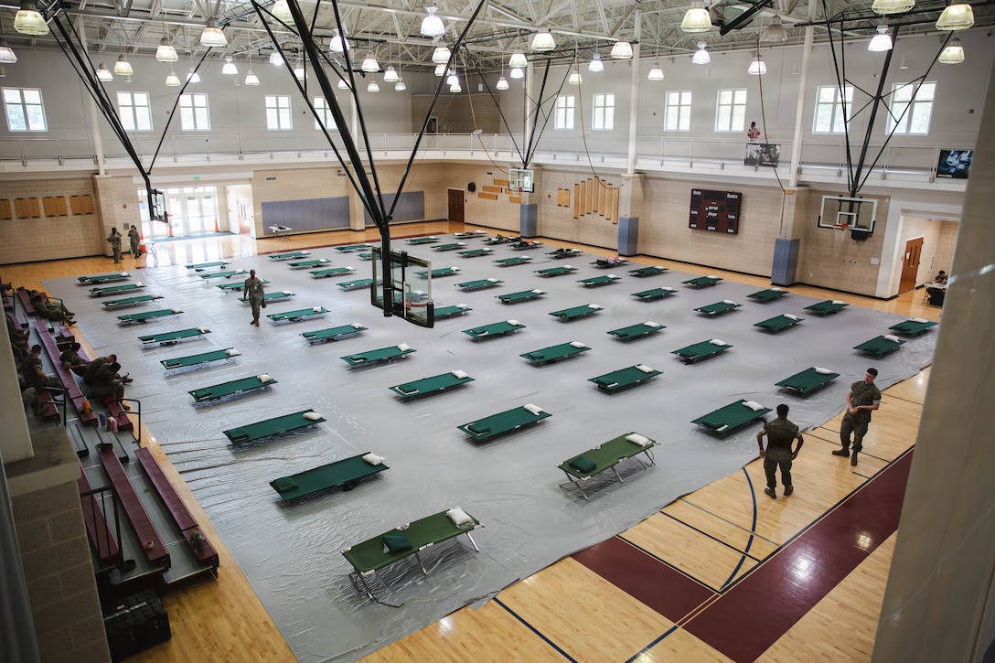 Cots are staged inside the destructive weather shelter at the Wallace Creek Fitness Center as part of the Carolina Breeze Destructive Weather Exercise, at Marine Corps Base Camp Lejeune, North Carolina, June 10, 2026.  MCB Camp Lejeune held the Carolina Breeze DWX to test the base’s emergency response capabilities in order to promote flexibility and readiness during the Atlantic hurricane season, which runs from June 1 to November 30. (U.S. Marine Corps photo by Daniela Chicas Torres)