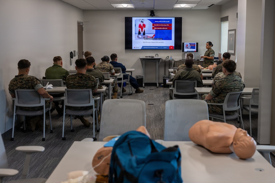 U.S. Marines with the Marine Corps Air Station New River Shelter Team attend a cardiopulmonary resuscitation class instructed by U.S. Navy Petty Officer 1st Class Roxana Q. Lacey, right, field medical technician, Marine Medium Tiltrotor Squadron 264, Marine Aircraft Group 26, 2nd Marine Aircraft Wing, at the Marine Corps Medical Home New River at MCAS New River, North Carolina, June 8, 2026. The MCAS New River Medical Team provided CPR training to the MCAS New River Shelter Team to enhance the base’s emergency response capabilities in order to promote flexibility and readiness during the Atlantic hurricane season, which runs from June 1 to November 30. (U.S. Marine Corps photo by Lance Cpl. Alyssa J. DeCrane)