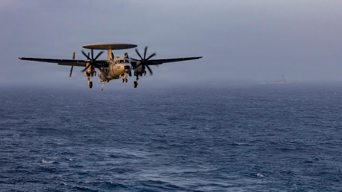 An E-2D Hawkeye, attached to Airborne Command & Control Squadron (VAW) 117, prepares to make an arrested landing on the flight deck of Nimitz-class aircraft carrier USS Abraham Lincoln (CVN 72), June 10, 2026. Abraham Lincoln is deployed to the U.S. 5th Fleet area of operations to support maritime security and stability in the Middle East. (U.S. Navy photo)