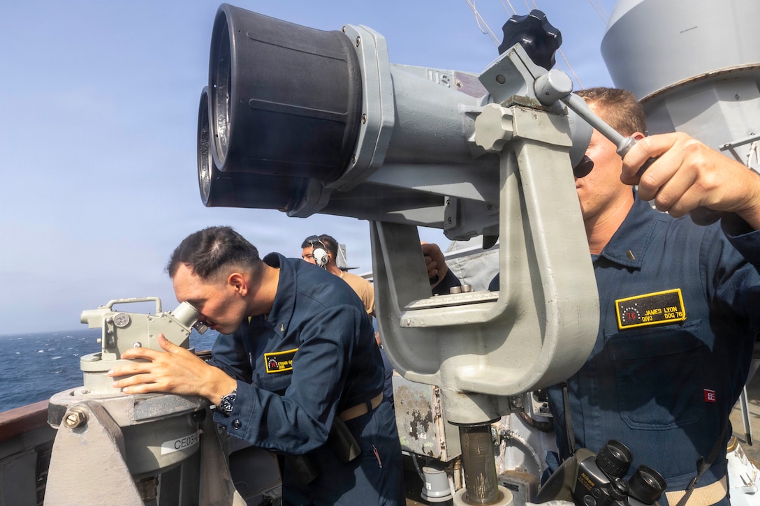 U.S. Sailors monitor a vessel of interest aboard Arleigh Burke-class guided-missile destroyer USS Higgins (DDG 76) June 12, 2026. Higgins is deployed to the U.S. 5th Fleet area of operations to support maritime security and stability in the Middle East. (U.S. Navy photo)