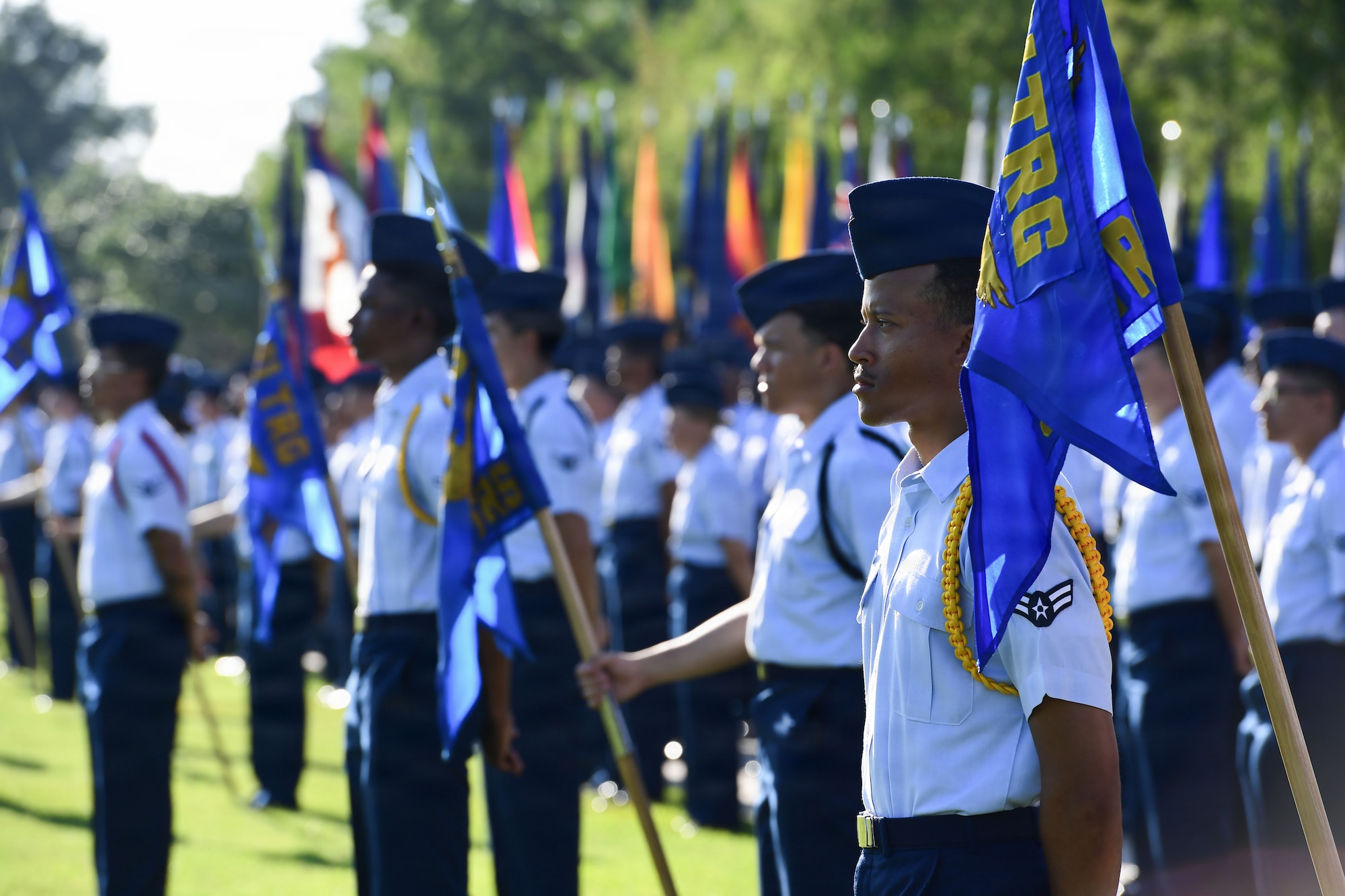 A large group of U.S. Airmen stand in formation.