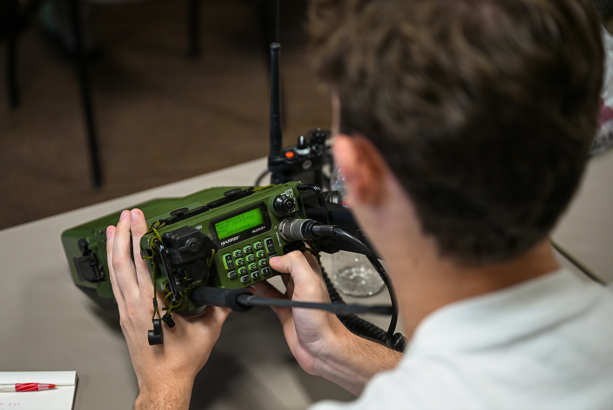Person holding radio.
