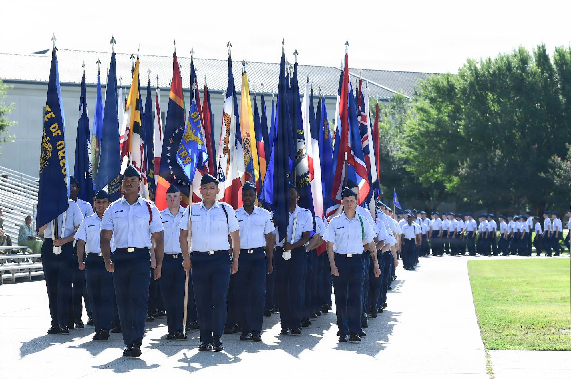 A group of U.S. Airmen march in formation.