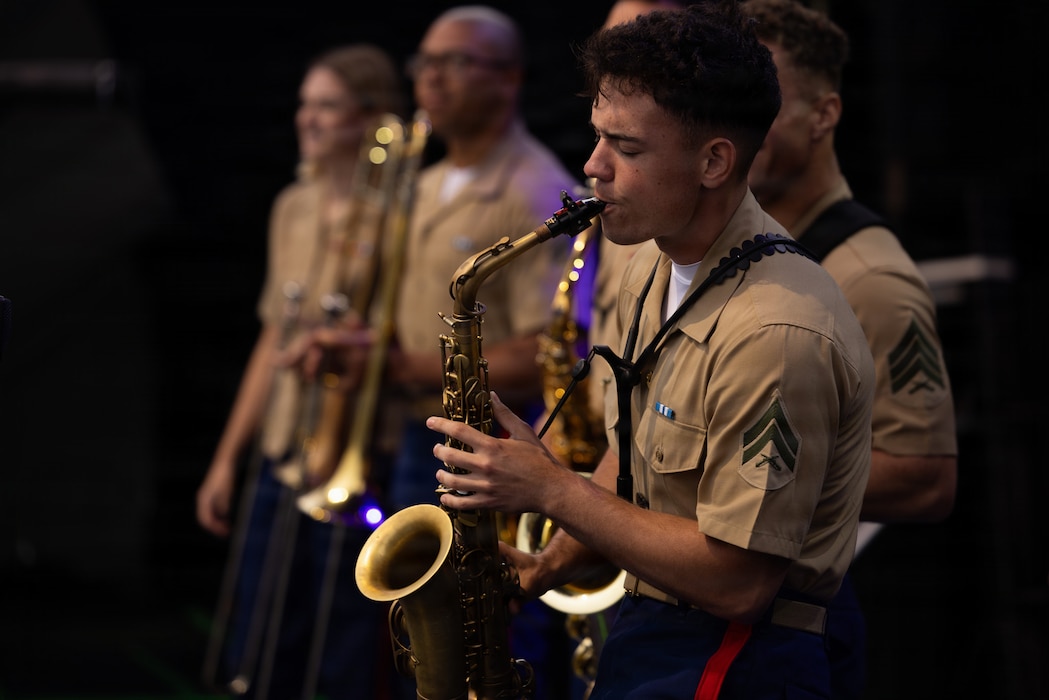 U.S. Marine Corps Cpl. Julian Garcia, from Florida, an alto saxophone musician with the 2nd Marine Aircraft Wing Band, performs during the Coca Cola 600 at Charlotte Motor Speedway in Concord, North Carolina, May 23, 2026. The U.S. Marine Corps supported the Coca-Cola 600, a NASCAR race held during Memorial Day weekend, with static displays of military aircraft and vehicles and participation in ceremonies. (U.S. Marine Corps photo by Lance Cpl. Michael Robinson)