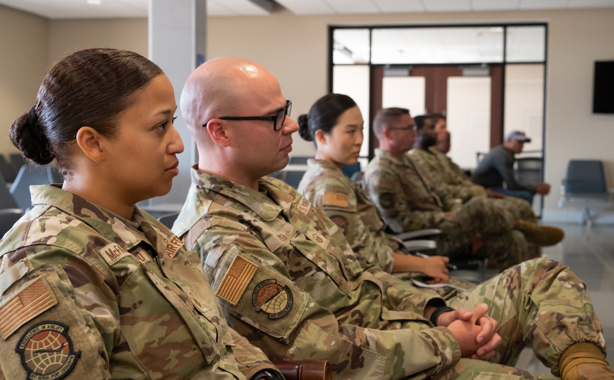 Air Transportation Specialist are briefed by senior enlisted leadership.