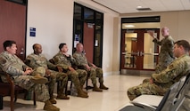 Senior Enlisted Leaders discuss training changes with Air Transportation Specialist.