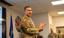 A Chief Master Sgt. briefs Air Transportation Specialist