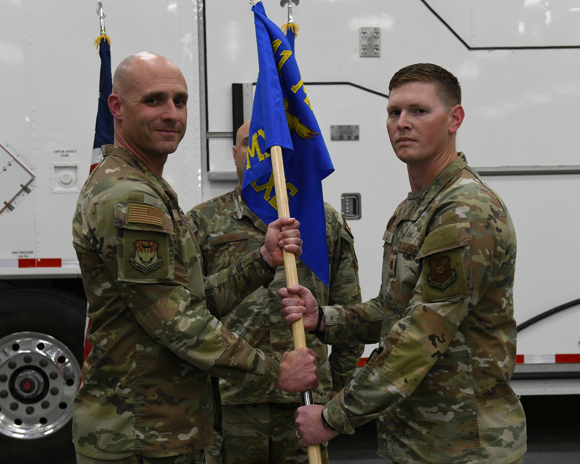 U.S. Air Force Maj. Drake Cales, right, accepts command of the 741st Maintenance Squadron from Col. Luke Stover, 341st Maintenance Group commander, during a change of command ceremony at Malmstrom Air Force Base, Montana, June 12, 2026.