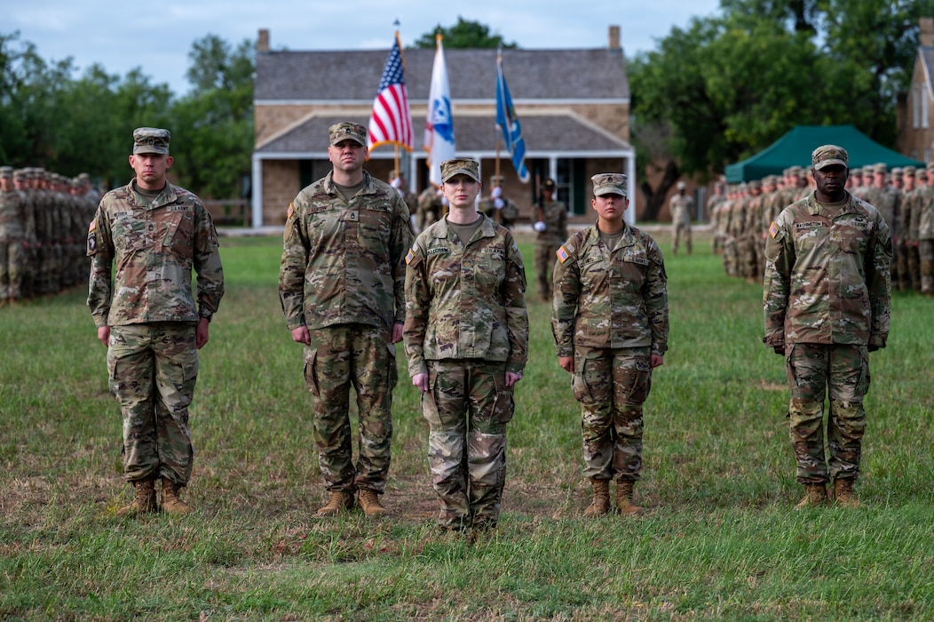U.S. Army Maj. Elisabeth Hallgren, 344th Military Intelligence Battalion executive officer and commander of troops, leads battalion staff onto the field during the change of command ceremony at the Fort Concho parade grounds, San Angelo, Texas, June 12, 2026. The ceremony marked the transition of command from Lt. Col. Raymond Kuderka to Lt. Col. Jonathan "Matt" Lovelace, who assumed command of the Silent Sentinels effective June 12, 2026. (U.S. Air Force photo by Senior Airman James Salellas)