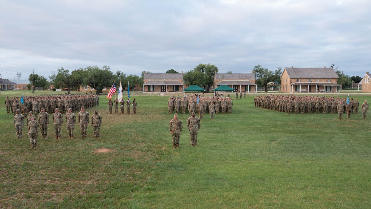 The 344th Military Intelligence Battalion stands at attention before a change of command ceremony at the Fort Concho parade grounds, San Angelo Texas, June 12, 2026. The 344th MIB trains Soldiers in three different military occupational specialties, military intelligence, and cyber professions, and it has more than 70 classes in session at any given time, over 40 blocks of instruction and three separate companies. (U.S. Air Force photo by Senior Airman Brian Lummus)