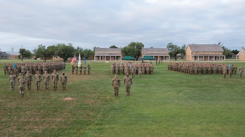 The 344th Military Intelligence Battalion stands at attention before a change of command ceremony at the Fort Concho parade grounds, San Angelo Texas, June 12, 2026. The 344th MIB trains Soldiers in three different military occupational specialties, military intelligence, and cyber professions, and it has more than 70 classes in session at any given time, over 40 blocks of instruction and three separate companies. (U.S. Air Force photo by Senior Airman Brian Lummus)