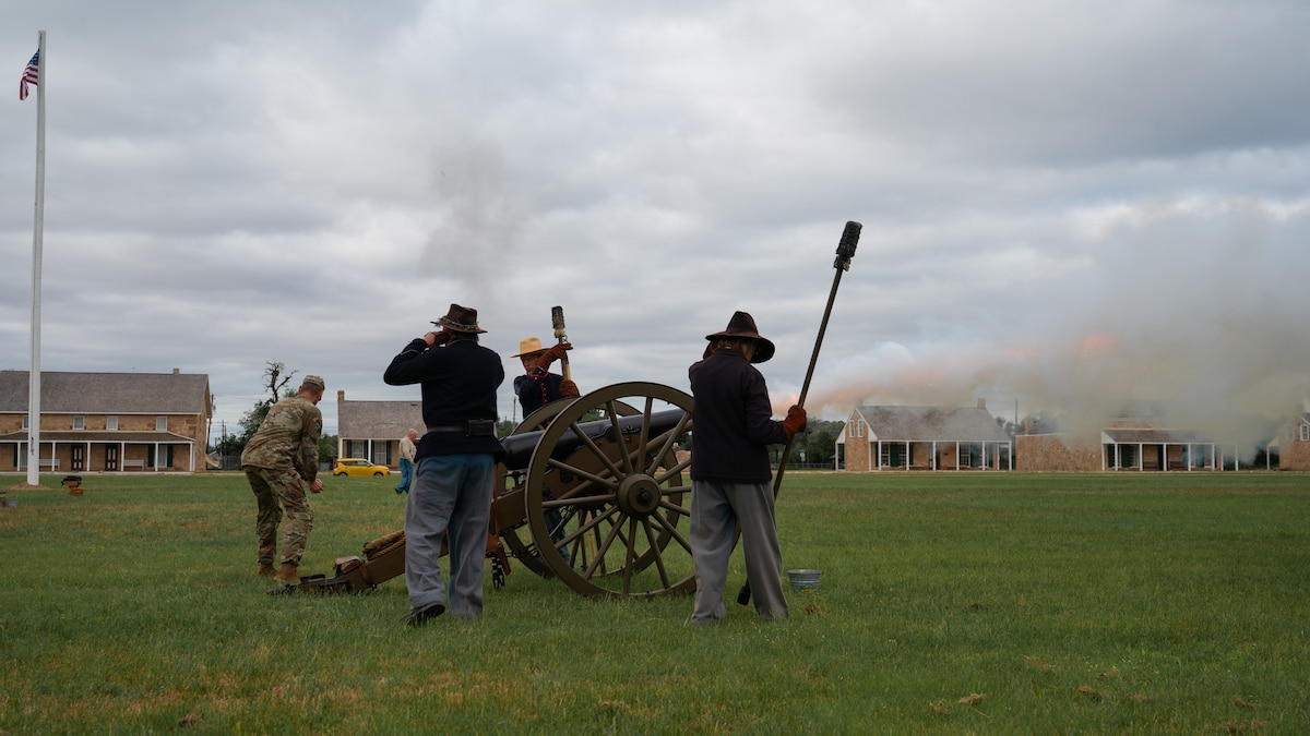 U.S. Army Lt. Col. Raymond Kuderka, outgoing commander, fires a 3-inch ordnance rifle after a change of command ceremony at the Fort Concho parade grounds, San Angelo Texas, June 12, 2026. Kuderka ended the ceremony and his time as commander with a “bang” by firing a replica of a cannon assigned to Fort Concho between 1875 and 1889. (U.S. Air Force photo by Senior Airman Brian Lummus)