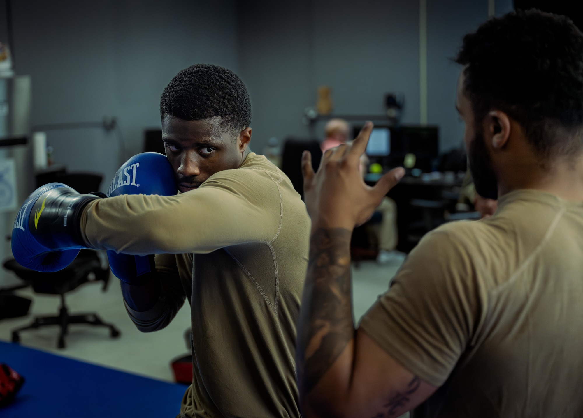 U.S. Air Force Senior Airman Daevon Larkins, 47th Security Forces Squadron trainer, (left) practices delivering a right hook with U.S. Air Force Senior Airman Raeshon Correa, 47th Security Forces Squadron defender, (right) at Laughlin Air Force Base, Texas, April 16, 2026. Security Forces Airmen learn combatives to master close-quarters self-defense, ensure weapons retention during physical altercations, and manage suspects without immediately resorting to lethal force. (U.S. Air Force photo by Airman 1st Class Harrison Sullivan)