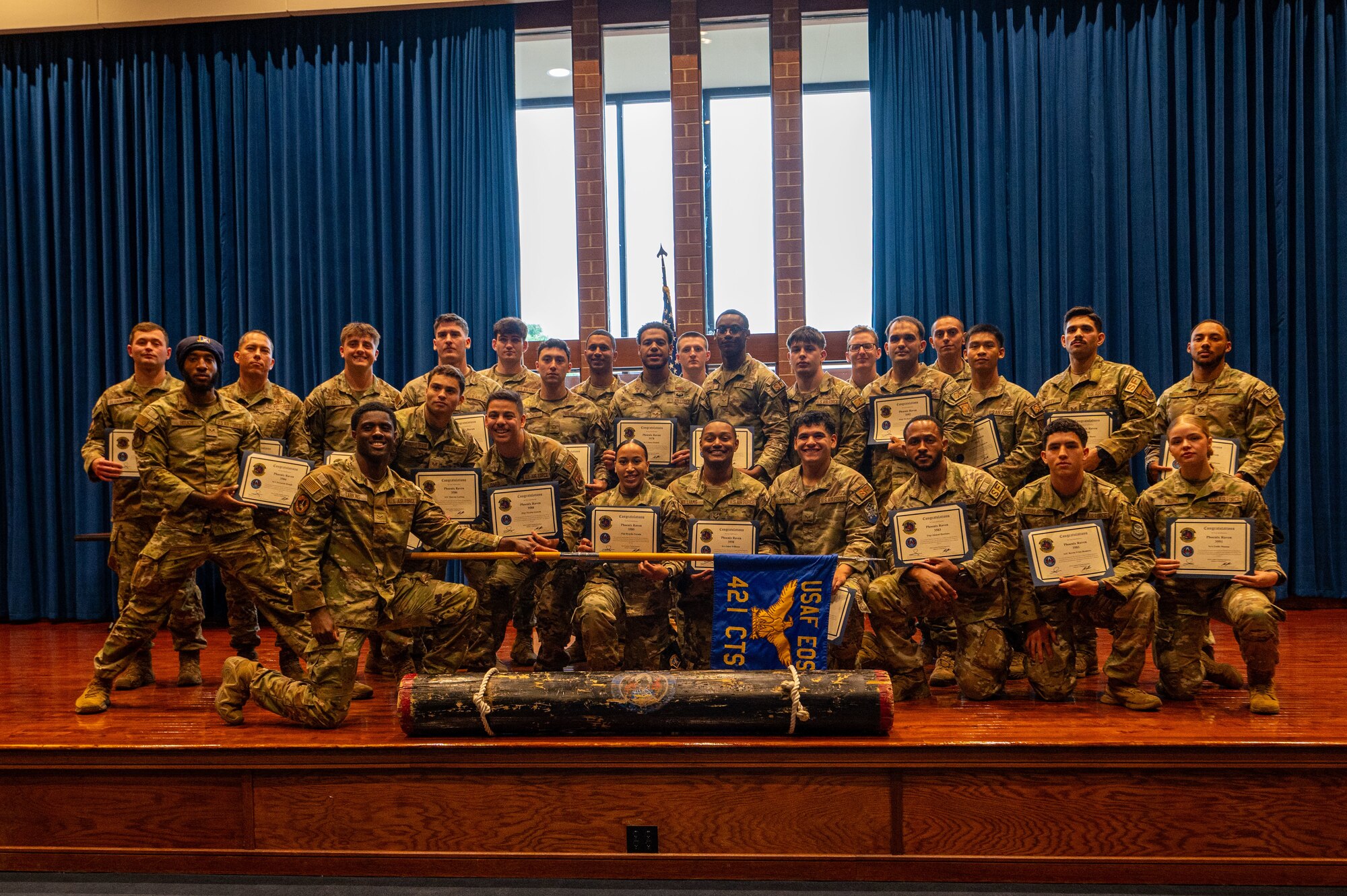 Phoenix Raven Qualification Course graduates pose for a group photo at Joint Base McGuire-Dix-Lakehurst, N.J., May 15, 2026. The course prepares future Ravens to ensure the security of aircrew, aircraft and cargo in hostile or high-threat areas. (U.S. Air Force photo by Jewaun McElroy)