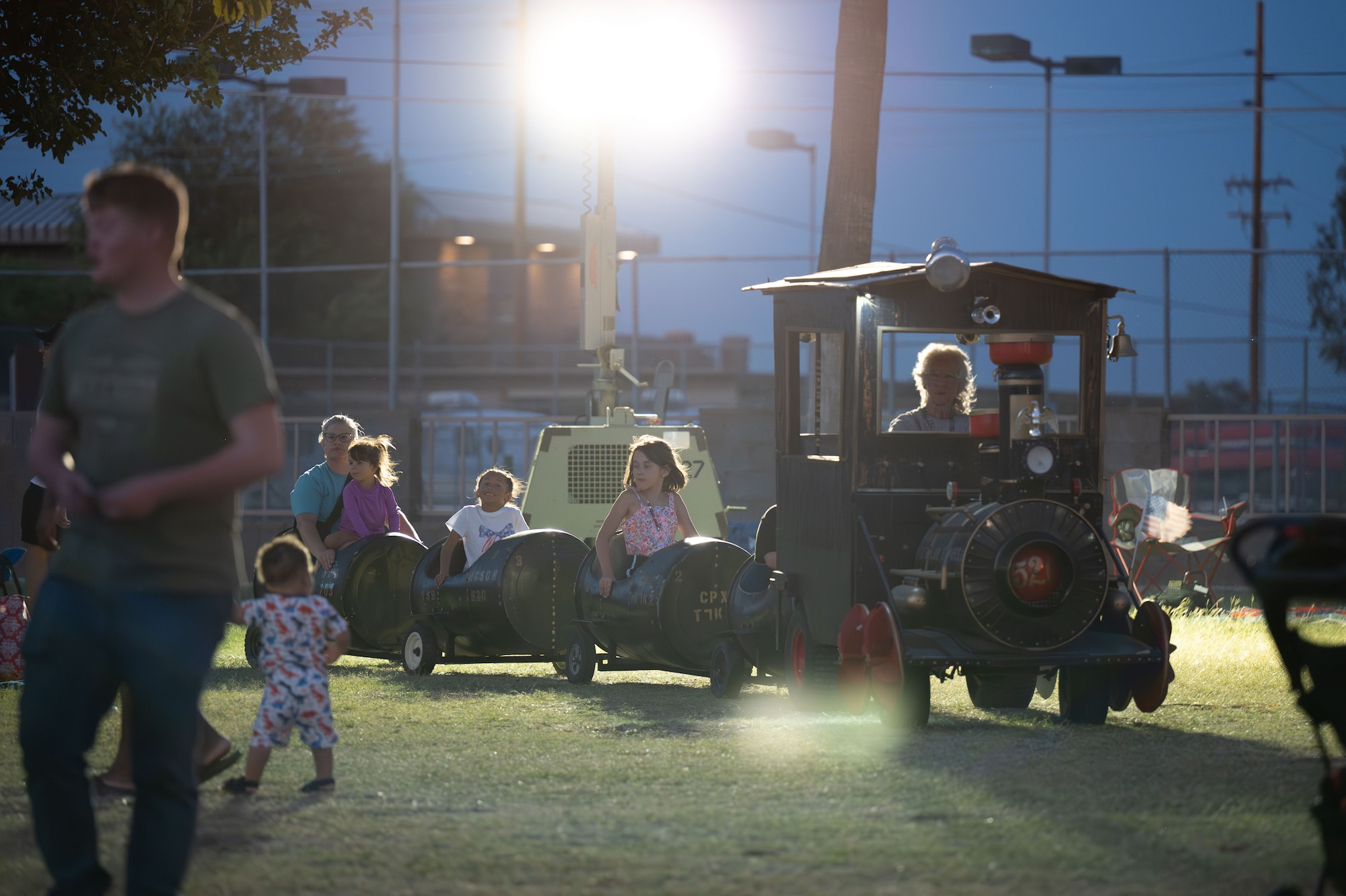 Children ride a miniature train during Freedom Fest at Davis-Monthan Air Force Base, Arizona, June 12, 2026. The annual celebration featured activities for all ages, providing opportunities for military families to spend quality time together while strengthening connections across the installation community. (U.S. Air Force photo by Airman 1st Class Jaden Kidd)