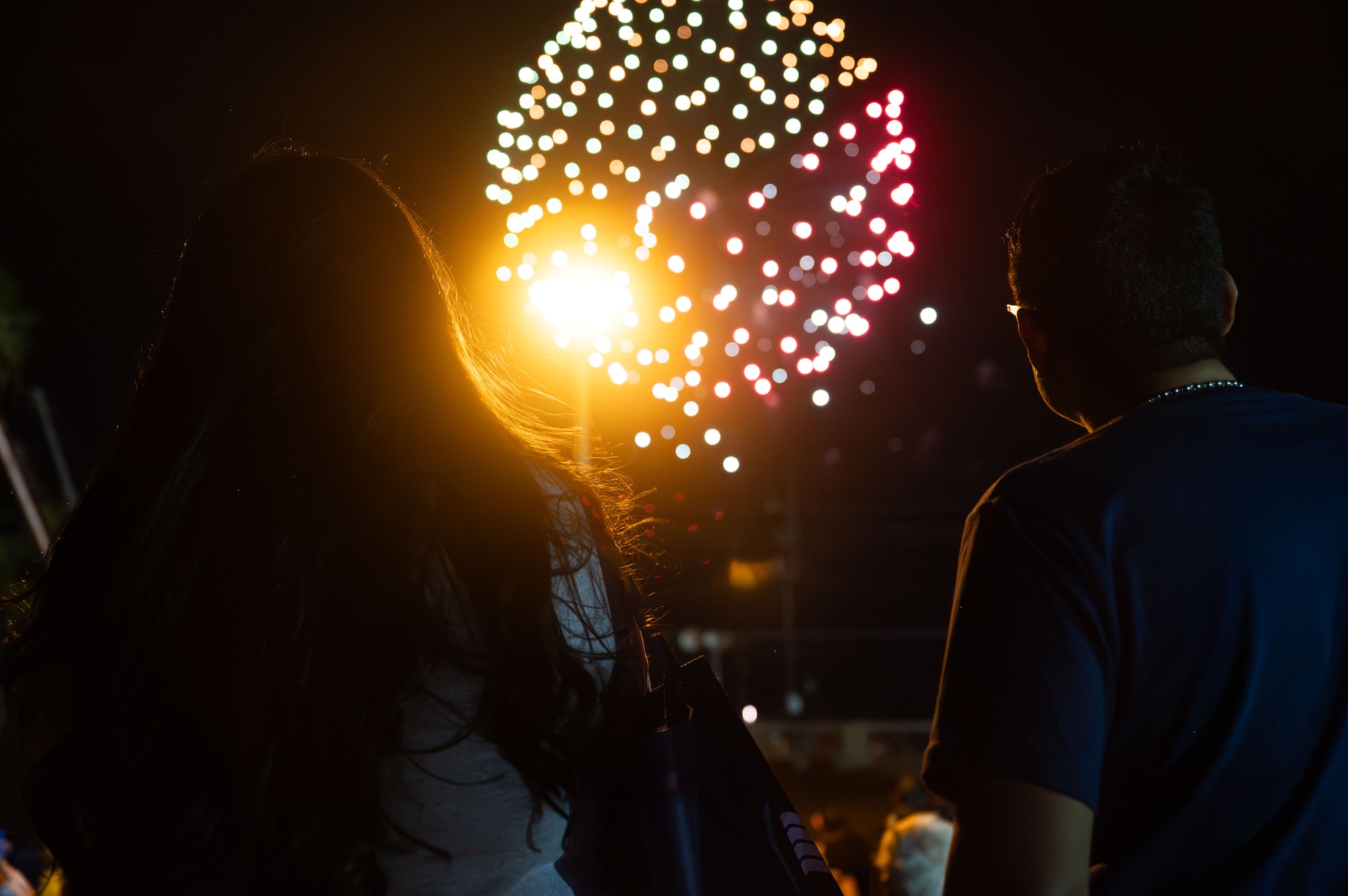 Fireworks ignite over Freedom Fest at Davis-Monthan Air Force Base, Arizona, June 12, 2026. The fireworks display concluded the annual event, which provided opportunities for Airmen and their families to connect, recharge and strengthen the bonds that contribute to a resilient force. (U.S. Air Force photo by Airman 1st Class Jaden Kidd)