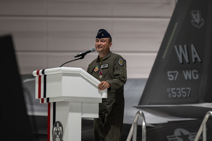 Brig. Gen. Lawrence Sullivan stands behind a podium giving his remarks.