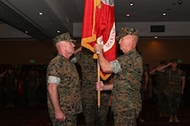 U.S. Marine Corps Brig. Gen. Kevin Collins, right, outgoing commanding general of 3rd Marine Logistics Group, prepares to relinquish command of 3rd MLG to Brig. Gen. Christopher Haar, incoming commanding general of 3rd MLG, during a change of command ceremony on Camp Kinser, Okinawa, Japan, June 3, 2026. The ceremony marked the formal transfer of authority and responsibility, honoring Collins’ leadership and service while welcoming Haar as the incoming commanding general. Marines, Sailors, family members, and distinguished guests gathered to recognize the enduring legacy of leadership within 3rd MLG and reaffirm the unit’s commitment to supporting III Marine Expeditionary Force throughout the Indo-Pacific. (U.S. Marine Corps photo by Lance Cpl. Rachel Mason)