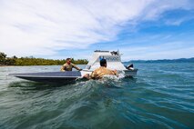 U.S. Army Pfc. Ethan Lair (left) and Spc. Jeremiah Ortiz (right), assigned to the 125th Intelligence and Electronic Warfare Battalion, 25th Infantry Division Artillery, 25th Infantry Division, recover an unmanned surface vessel during Exercise Salaknib  2026 at Casiguran, Philippines, June 9, 2026.