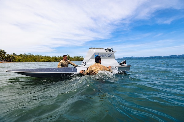 U.S. Army Pfc. Ethan Lair (left) and Spc. Jeremiah Ortiz (right), assigned to the 125th Intelligence and Electronic Warfare Battalion, 25th Infantry Division Artillery, 25th Infantry Division, recover an unmanned surface vessel during Exercise Salaknib  2026 at Casiguran, Philippines, June 9, 2026.