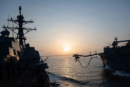 Arleigh Burke-class guided-missile destroyer USS Pinckney (DDG 91) conducts a replenishment-at-sea with Lewis and Clark-class dry cargo and ammunition ship USNS Carl Brashear (T-AKE 7) during Operation Epic Fury, March 19, 2026. (U.S. Navy photo)