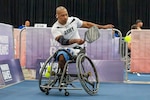 Retired U.S. Army Staff Sgt. Gene Calantoc returns a shot during a pickleball match at the Henry B. Gonzalez Convention Center in San Antonio, Texas, June 13, 2026. The 2026 Warrior Games takes place June 13-20 in San Antonio, Texas, bringing together nearly 200 wounded, ill and injured service members and veterans from the U.S. Army, Marine Corps, Navy/Coast Guard, Air Force/Space Force, and U.S. Special Operations Command to compete across multiple adaptive sports. (U.S. Army photo by Sgt. Pomare Te’o Jr.)