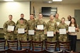 Pennsylvania Air National Guard and Pennsylvania National Guard members pose after completing CPR and automated external defibrillator (AED) certification during a TAG Safety Stand Down at Biddle Air National Guard Base, Pa., May 28, 2026. The training reinforced life-saving emergency response skills and readiness across multiple mission sets within the 111th Attack Wing. (U.S. Air National Guard photo by Senior Airman Matthew Bergh)