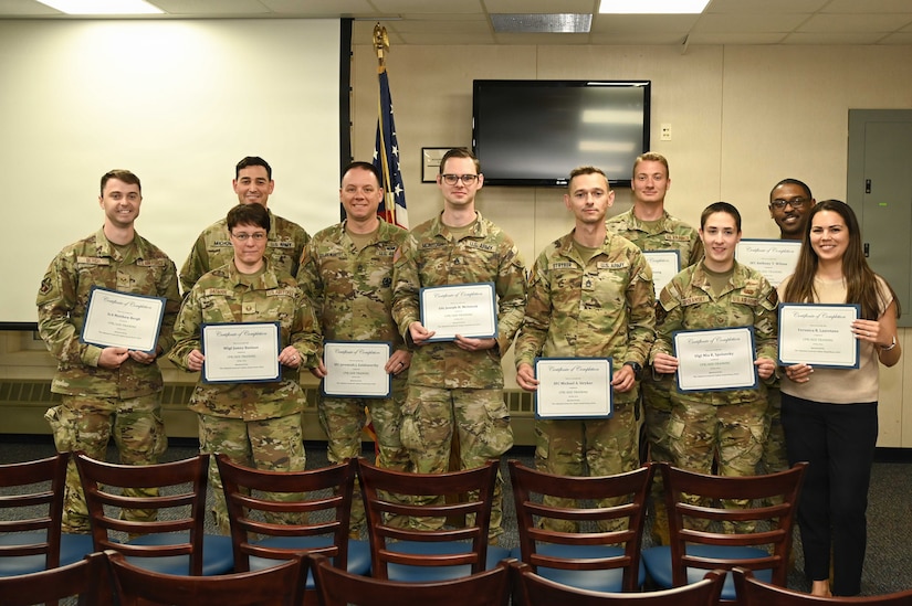 Pennsylvania Air National Guard and Pennsylvania National Guard members pose after completing CPR and automated external defibrillator (AED) certification during a TAG Safety Stand Down at Biddle Air National Guard Base, Pa., May 28, 2026. The training reinforced life-saving emergency response skills and readiness across multiple mission sets within the 111th Attack Wing. (U.S. Air National Guard photo by Senior Airman Matthew Bergh)