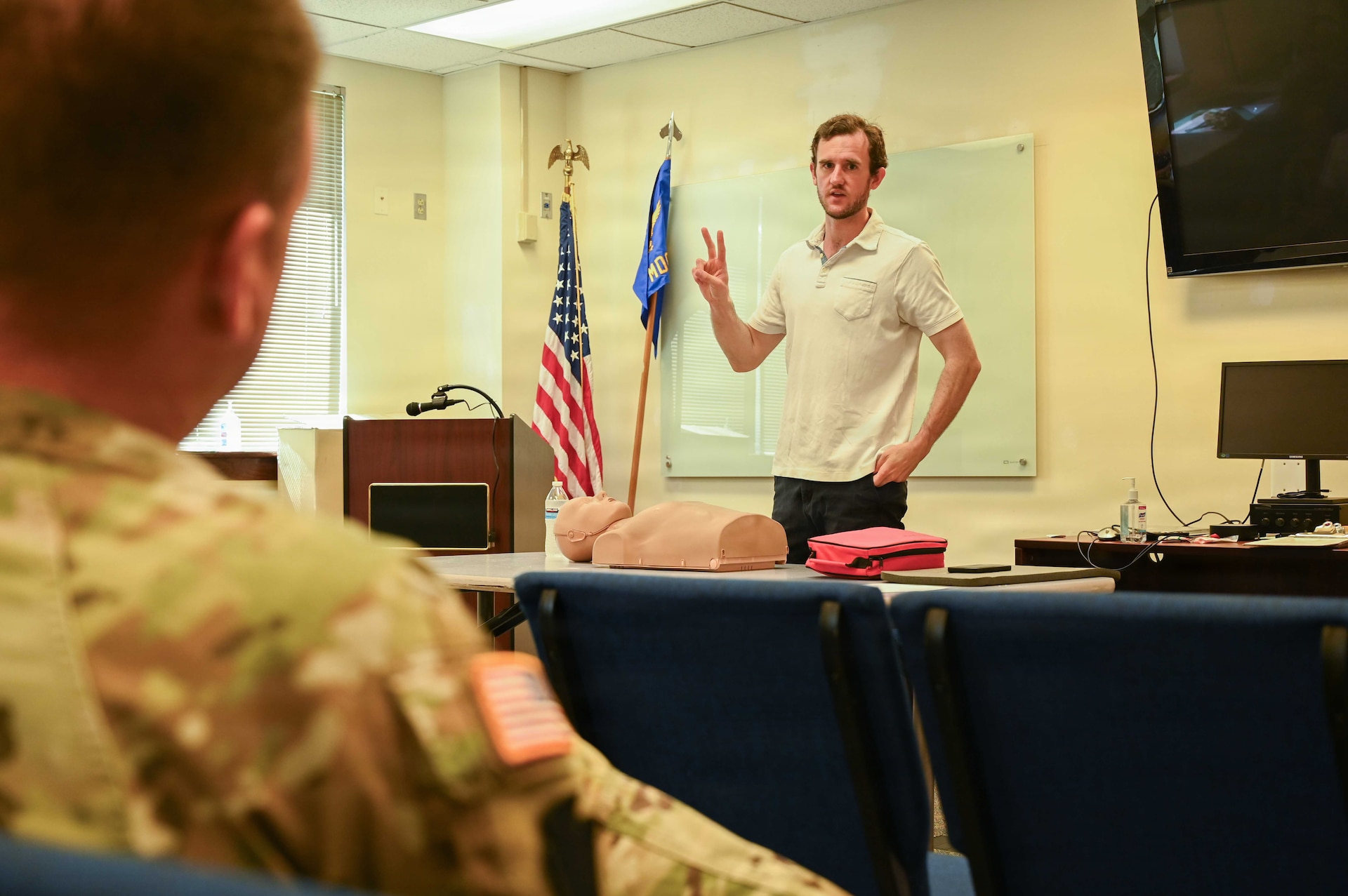 Luke Humphrey, CPR/AED and first aid instructor with Cardiac Care and Safety Inc., demonstrates life-saving techniques during a TAG Safety Stand Down at Biddle Air National Guard Base, Pa., May 28, 2026. Humphrey led Airmen and civilian employees through certification training focused on emergency response, casualty care, and cardiac arrest intervention. (U.S. Air National Guard photo by Senior Airman Matthew Bergh)