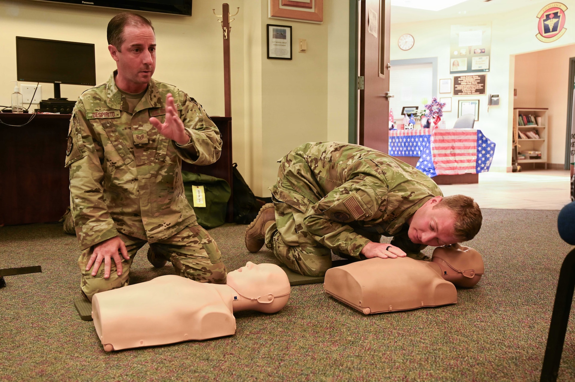 Staff Sgt. Anthony Despirito, 111th Security Forces Squadron, and Tech. Sgt. Michael Rich, 201st RED HORSE Squadron, perform hands-on CPR/AED training during a TAG Safety Stand Down at Biddle Air National Guard Base, Pa., May 28, 2026. The exercise allowed Airmen to apply classroom instruction in realistic emergency response scenarios. (U.S. Air National Guard photo by Senior Airman Matthew Bergh)