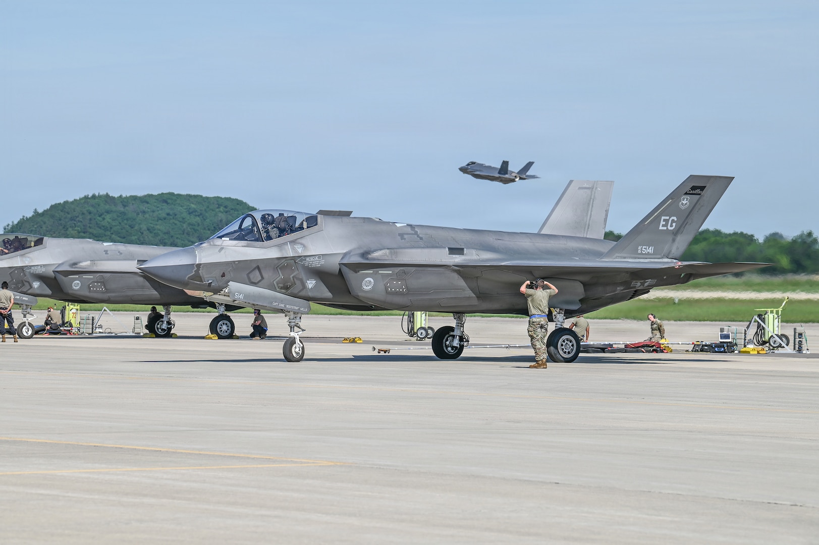 A U.S. Air Force tactical aircraft maintenance specialist assigned to the 33rd Fighter Wing, Florida Air National Guard, marshals an F-35A Lightning II aircraft for launch during Sentry North 2026 at Volk Field Combat Readiness Training Center, Camp Douglas, Wisconsin, June 4, 2026.