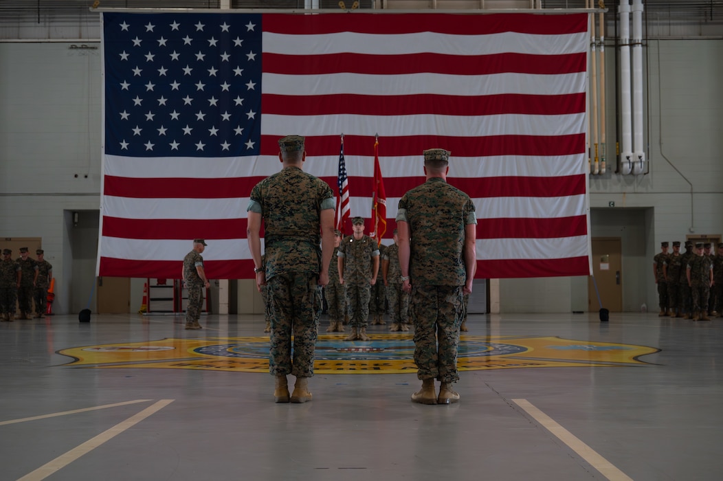 U.S. Marine Corps Lt. Col. Brian Meade, outgoing Marine Corps Detachment Goodfellow commanding officer (right), and Lt. Col. David Rubio, incoming MCD Goodfellow commanding officer (left), stand at attention after the passing of the colors during a change of command ceremony at the Louis F. Garland Department of War Fire Academy, Goodfellow Air Force Base, Texas, June 12, 2026. The change of command ceremony represents the official passing of authority from the outgoing commanding officer to the incoming commanding officer. (U.S. Air Force photo by Senior Airman Brian Lummus)